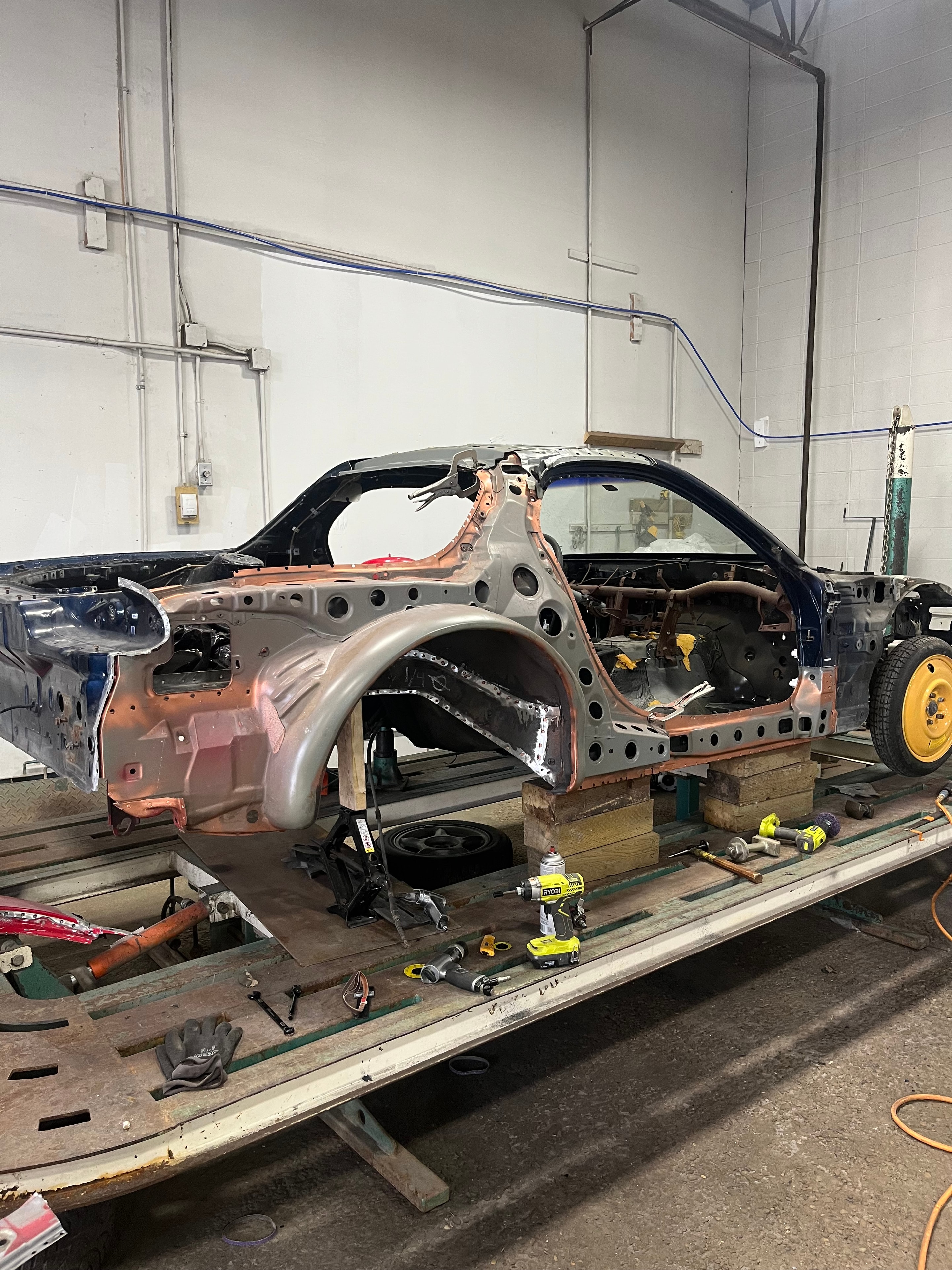 Vehicle undergoing frame correction in the MACART workshop