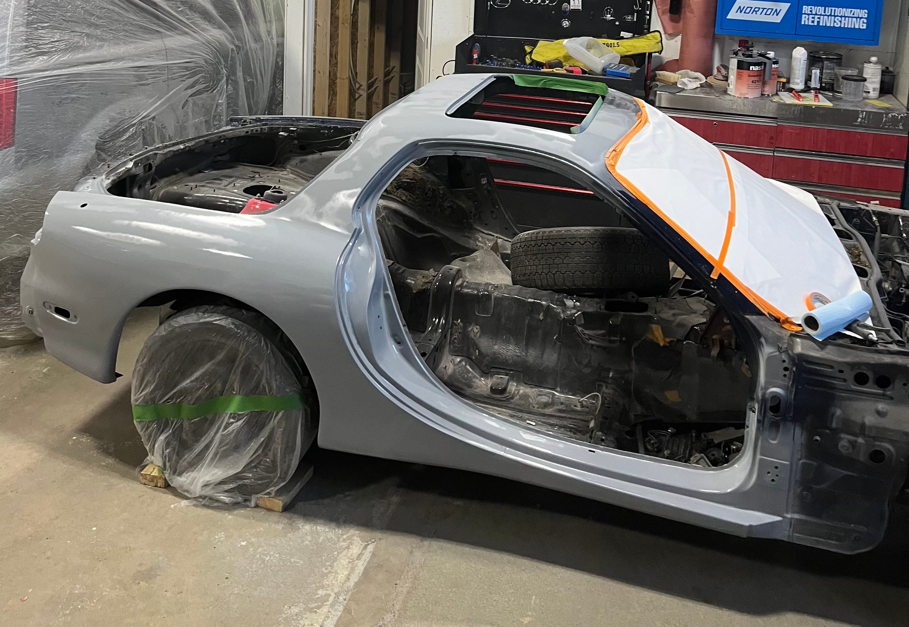 Partially restored vehicle body prepared for refinishing in the MACART workshop
